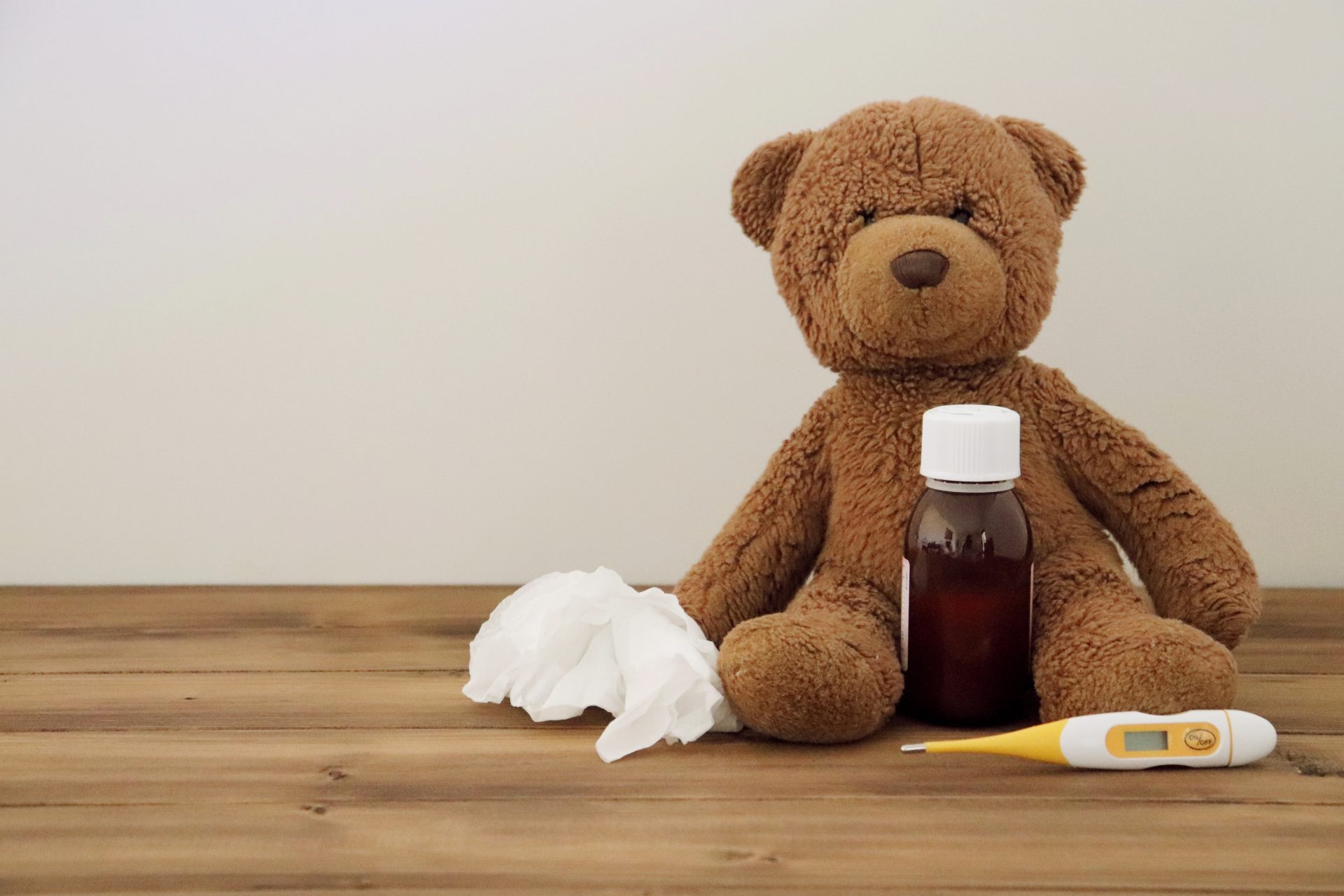 Teddy with medicine and tissues are all needed if you can't sleep due to illness