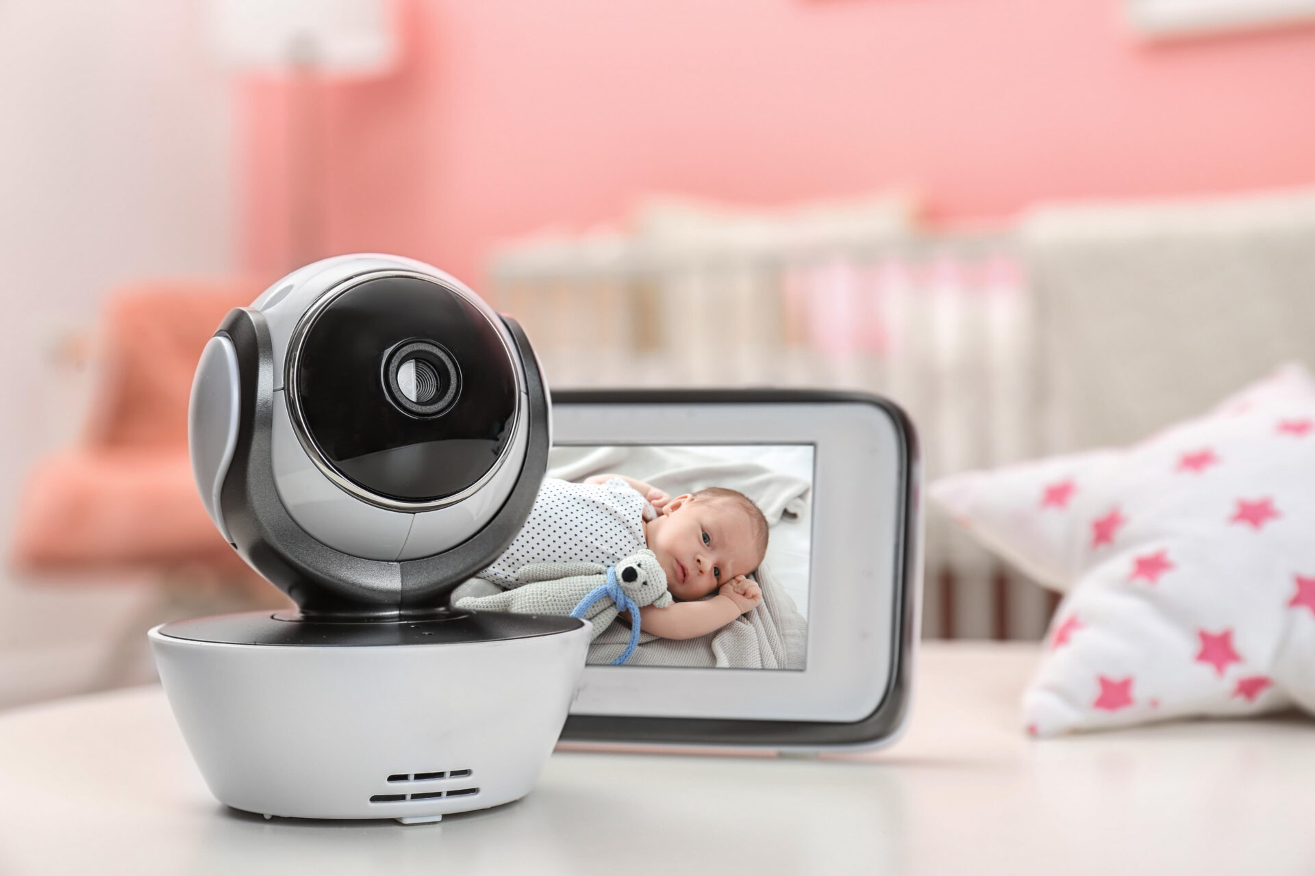Baby monitor and screen being used to watch the baby during sleep training